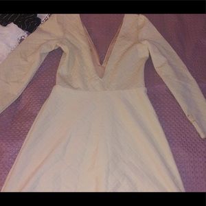 Cream colored V cut front and back beautiful dress